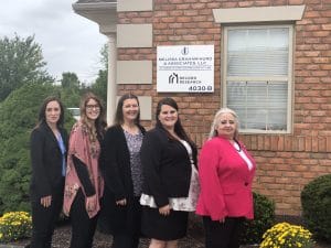 Team photo | paper cut out of family and gavel | Melissa Graham-Hurd & Associates