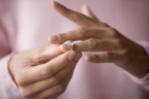 close up of woman removing ring concept